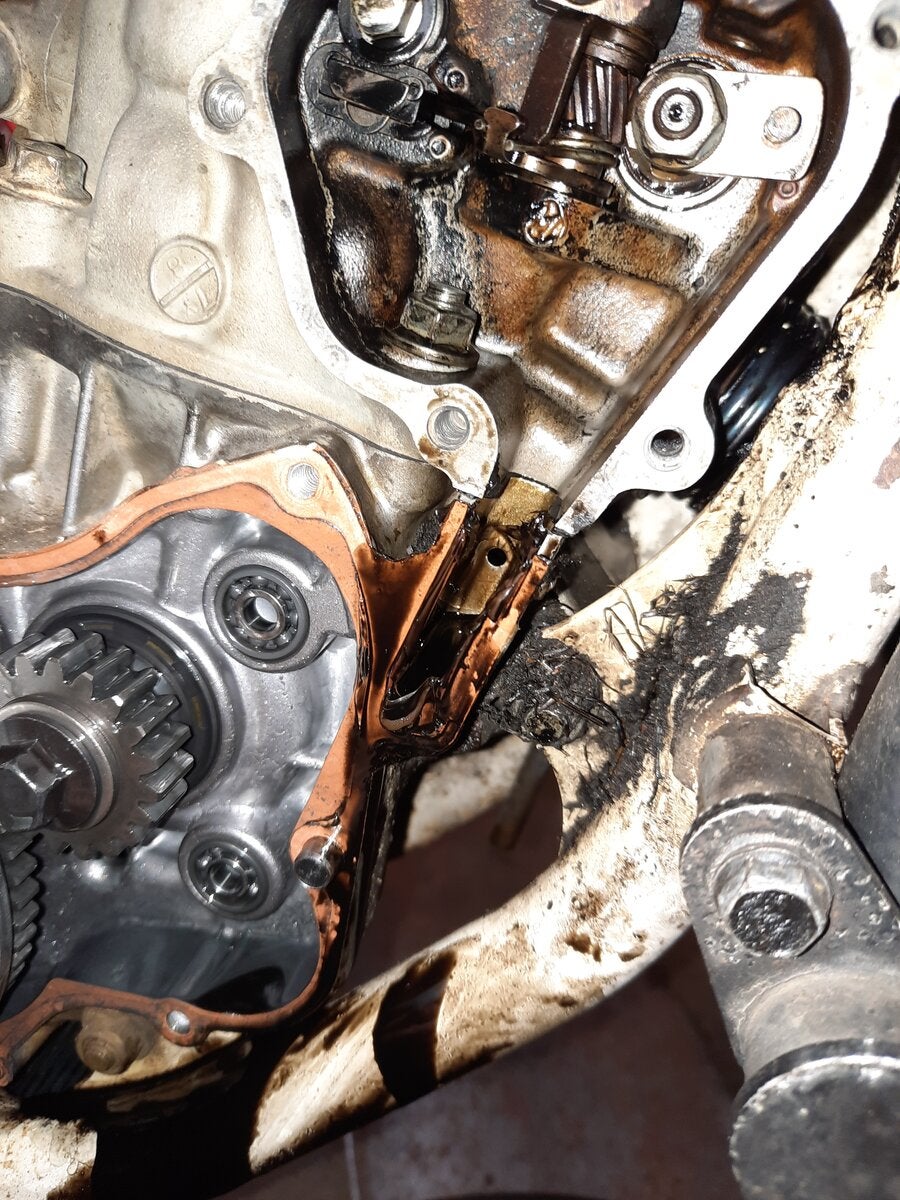 Black oil leaking through small hole Honda 2 Stroke ThumperTalk
